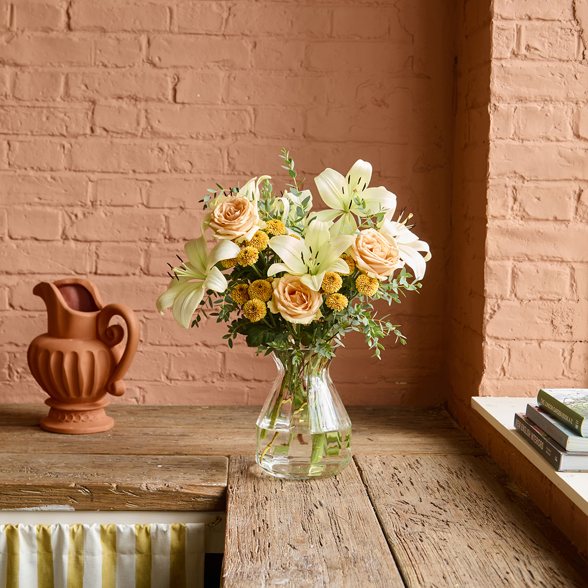 Black Friday Flower bouquet with peach roses & lilies | Send flowers online | Fireside Glow | size: letterbox image